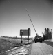 Three Men Securing Sign Interstate 189