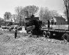 Construction Site with Men and Vehicles Looking West