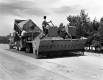 Two Men on Construction Vehicle on I-89