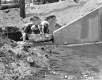 Three Men at Bridge Construction in Roxbury