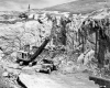 Two Construction Vehicles at Outcrop on I-89