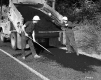 Two Men Patch Road with Pavement