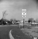 Traffic Signs in Front of Houses