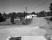 Dirt Road Towards Houses