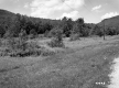 Field between Road and Mountains