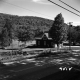 House by Wooded Hill