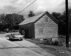 Car by Barn