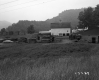 Buildings and Wooden Pallets in a Field