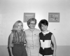 Three Women in Personnel Pose Indoors