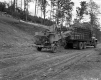 Two Men with Construction Vehicle and Machinery