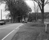Two Trucks Paint Road in Rural Area