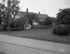 Dwelling and Landscape Next to Road