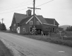 Barn and Utility Poles next to Paved Road