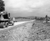 Truck and Paved Road with Wooden Fence