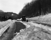 Snow Removal Along Wooded Stretch of Highway