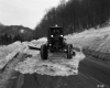 Snow Removal Along Wooded Stretch of Highway