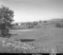 Dwelling and Barn on Landscape Near Highway 22A