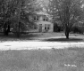 View of House with Trees Next to Road