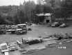 Wooden Frame Building with Trucks and Construction Materials