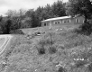 Dwelling with Stone Wall and Gravel Road