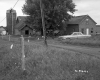 Farm Buildings with Fence, Automobile, and Silo 