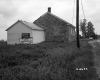 Two Buildings Stand Next to Road