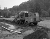 Construction Vehicles at Construction Site Near Forest