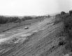 Automobile on Dirt Road in Construction Area 