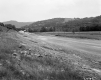 Dirt Road Under Construction with Surrounding Landscape
