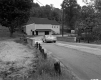 Automobile on Bridge with Building in Background