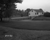 Dwelling with Manicured Lawn and Metal Swing Set