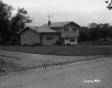 Single Family Home with Driveway and Dirt Road 