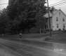 Colonial Two Story House along Paved Road
