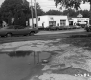 American Car Dealership With Busy Street