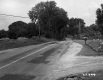 Dirt Driveway Intersects Paved Road