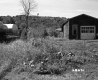 House by Oil Tanks