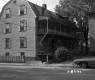 Apartment Building  with Car Parked in Front