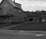 Three Story Apartment with Hill in Background