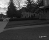 Busy Street with Lawns and Dwellings In Barre