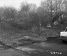 Unpaved Road with Grassland Plants and Dwelling
