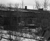 Side view of Warehouse with Railroad Tracks and Truck