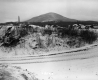 View of Bennington Battle Monument and Mountain Ridge from an Unpaved Road