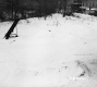 Clearing with River and Commercial Buildings
