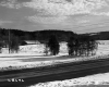 Commercial Buildings with Snowy Pasture