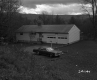 Car Parked by House