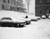 Snow Covered Parking Lot at 133 State in Montpelier, With White Building