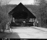 Burned Bridge in Woodstock, People Inspecting Damage at Entrance