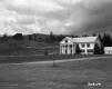 White Colonial Dwelling Next to Highway 91 in Lyndon