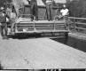  Men Applying Chip Seal on Bridge Section 3