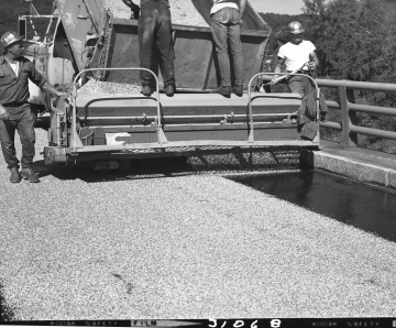  Men Applying Chip Seal on Bridge Section 3
